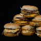 A haphazard pyramid of six sloppy Big Mac burgers from McDonald's
